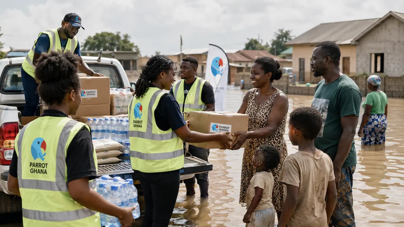 Parrot Ghana worker handing supplies to a community member.
